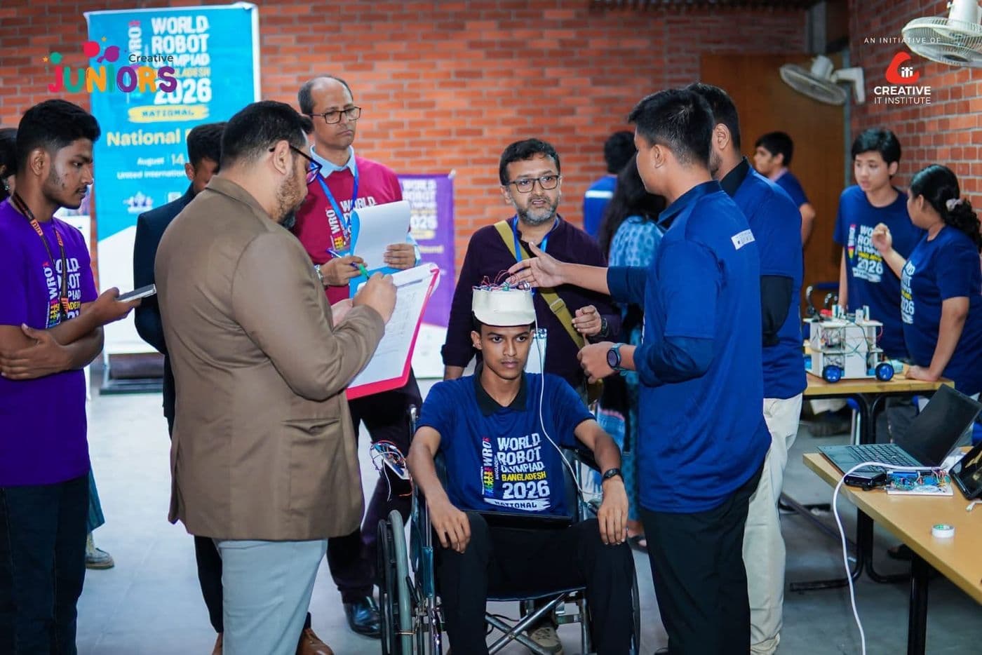 Judges testing our head-controlled wheelchair at WRO Bangladesh 2026