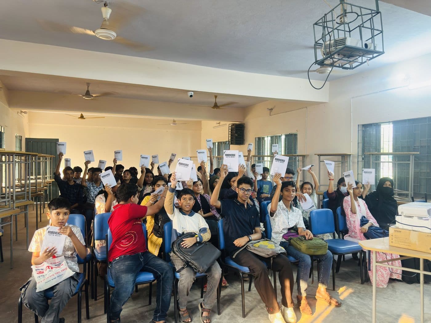 Roboverse 2026 participants with their notebooks